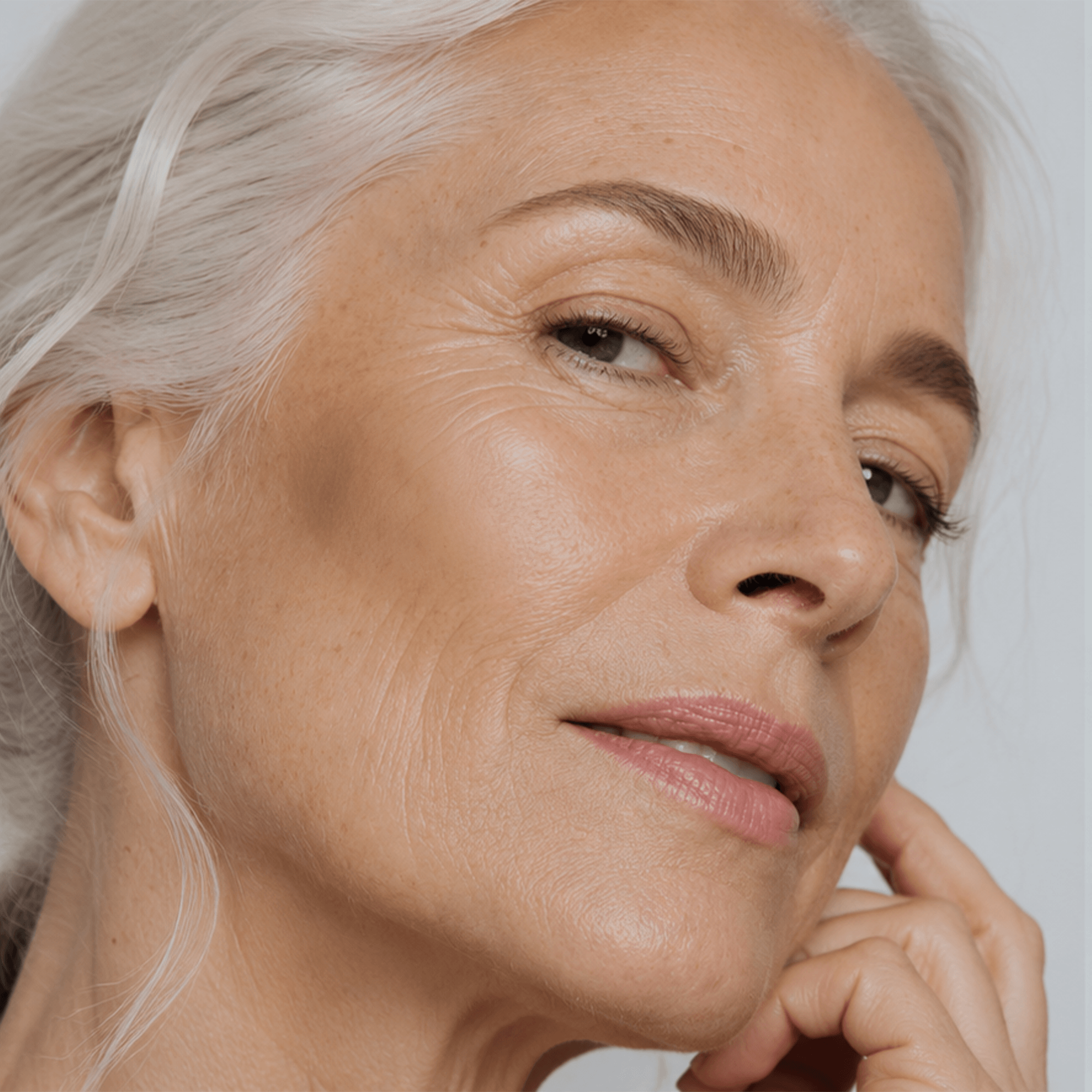 Mature woman with healthy-looking skin, representing age-positive skincare and natural beauty.